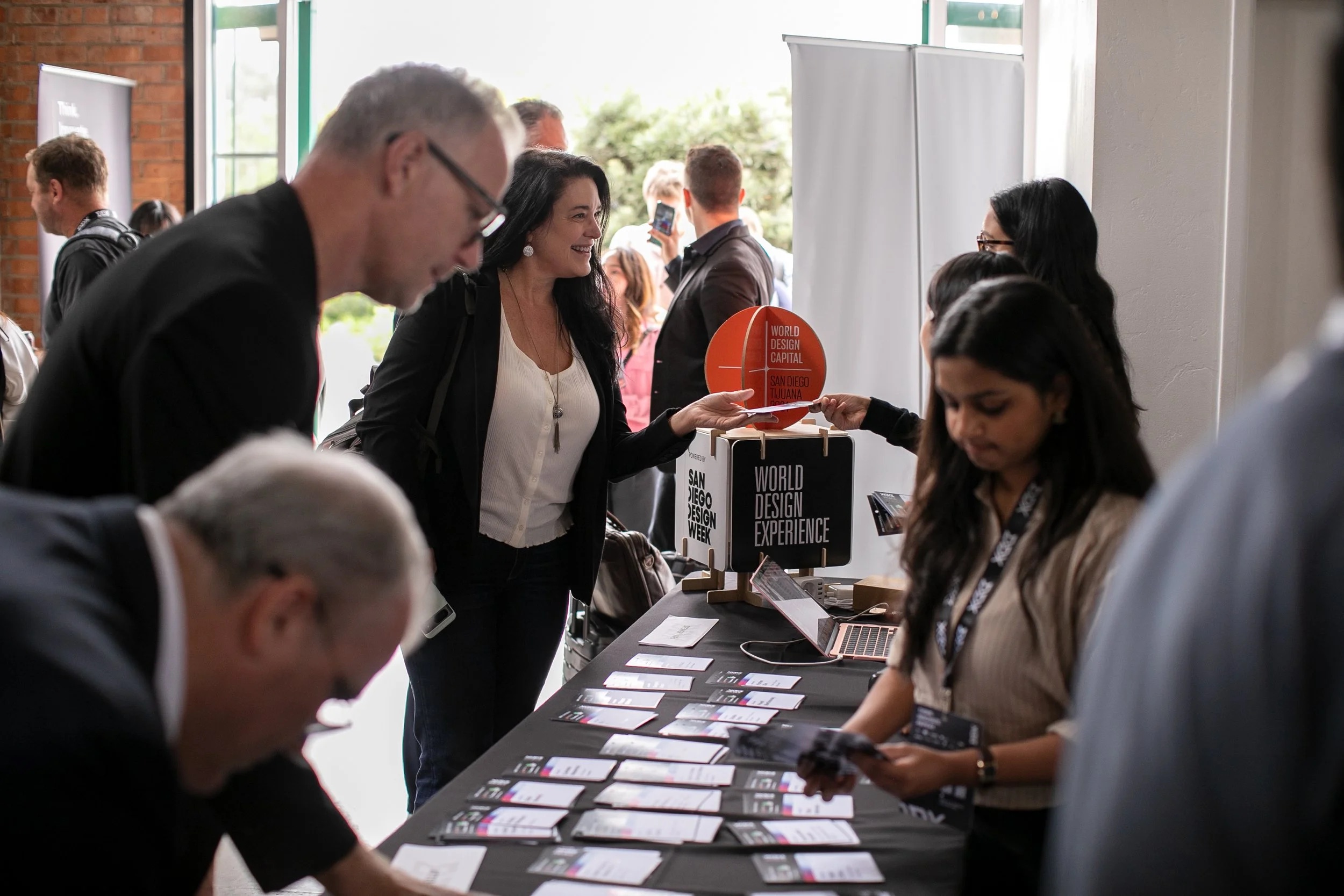 Attendees networking at DDX registration